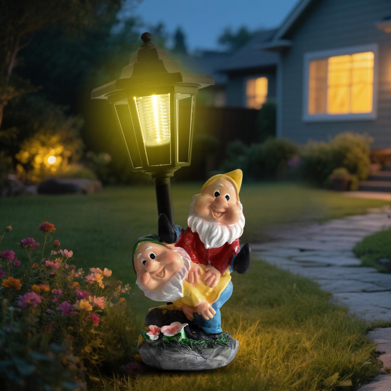 Gnome garden ornament with solar light in a backyard at night