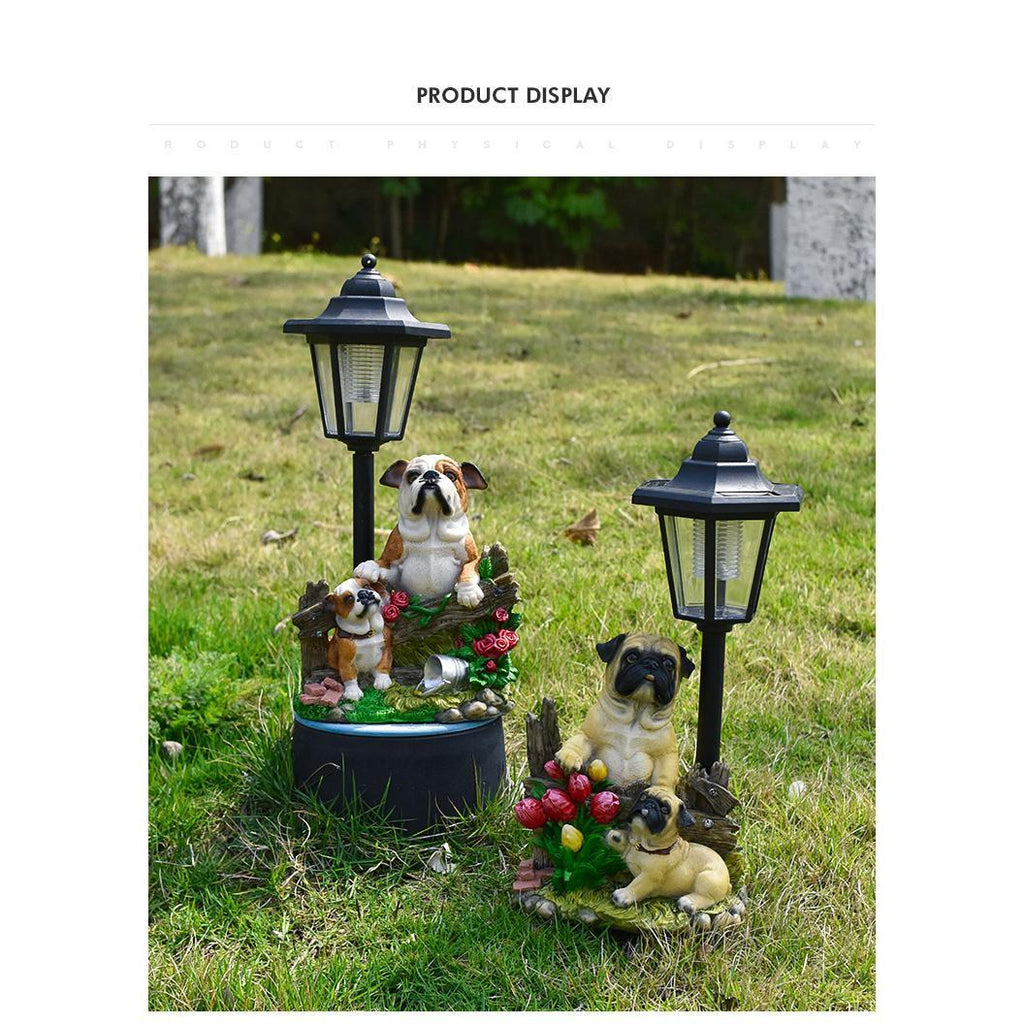 Solar-powered garden lights with dog figurines on grass