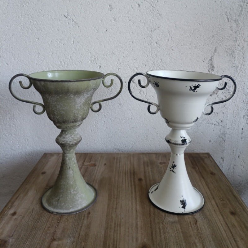 Distressed metal trophy planter with scrolled handles, wide rim; vintage green and white