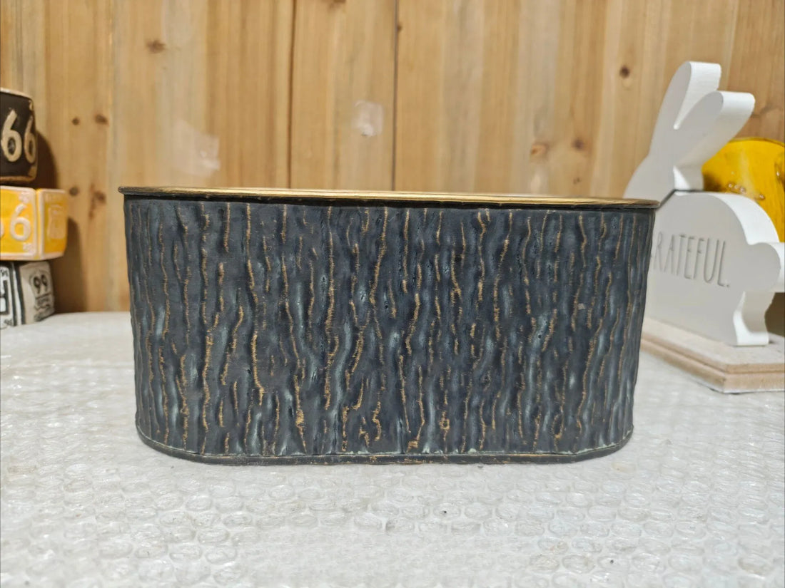 Short oval metal planter with faux bark texture and gold-trim rim, dark charcoal