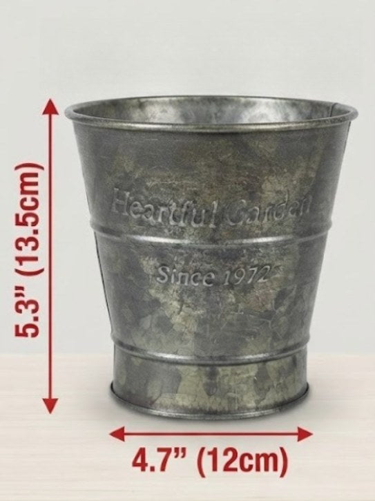 Antique-style metal planter, embossed scalloped texture with weathered dark green finish