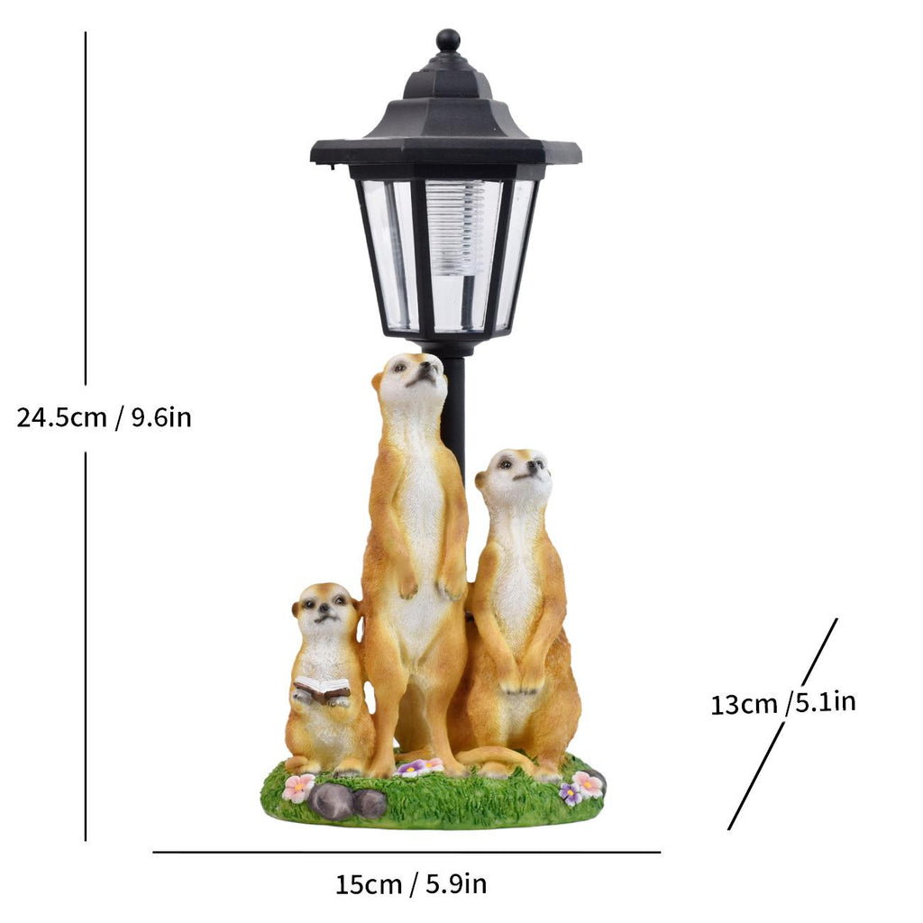 Solar LED lantern garden statue with a group of meerkats sitting on grass