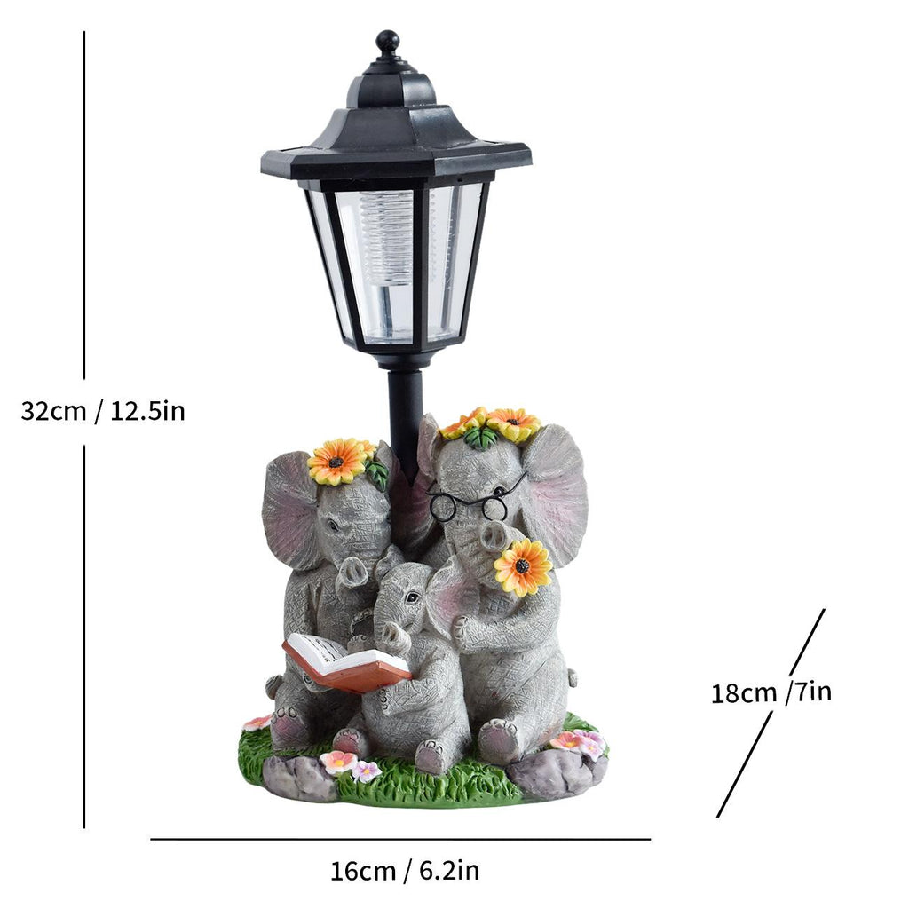 Solar LED lantern garden statue with seated animal figures, flowers, and tree stump base