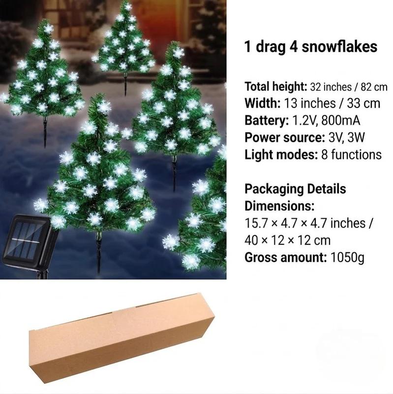 Outdoor solar Christmas tree stakes with white snowflake-style LED lights and solar panel