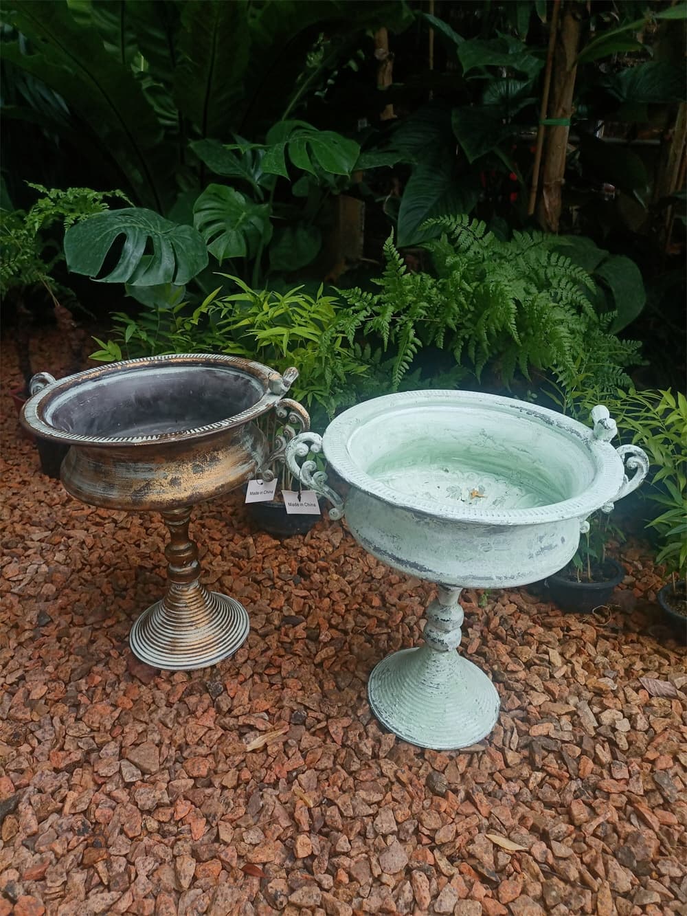 Distressed metal pedestal planter urn with bowl top, side handles, and spiral pedestal