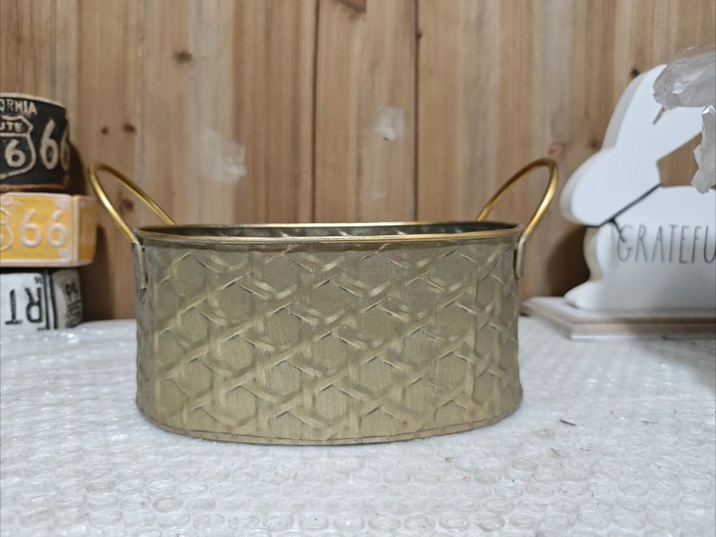 Gold-toned metal planter tub with raised diamond embossing and two side handles