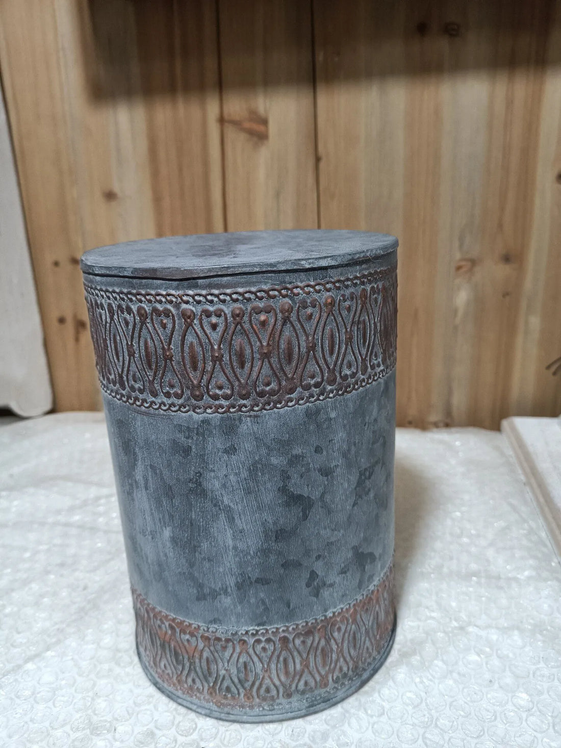 Blue-gray embossed iron storage bucket with matching lid and decorative patterned band